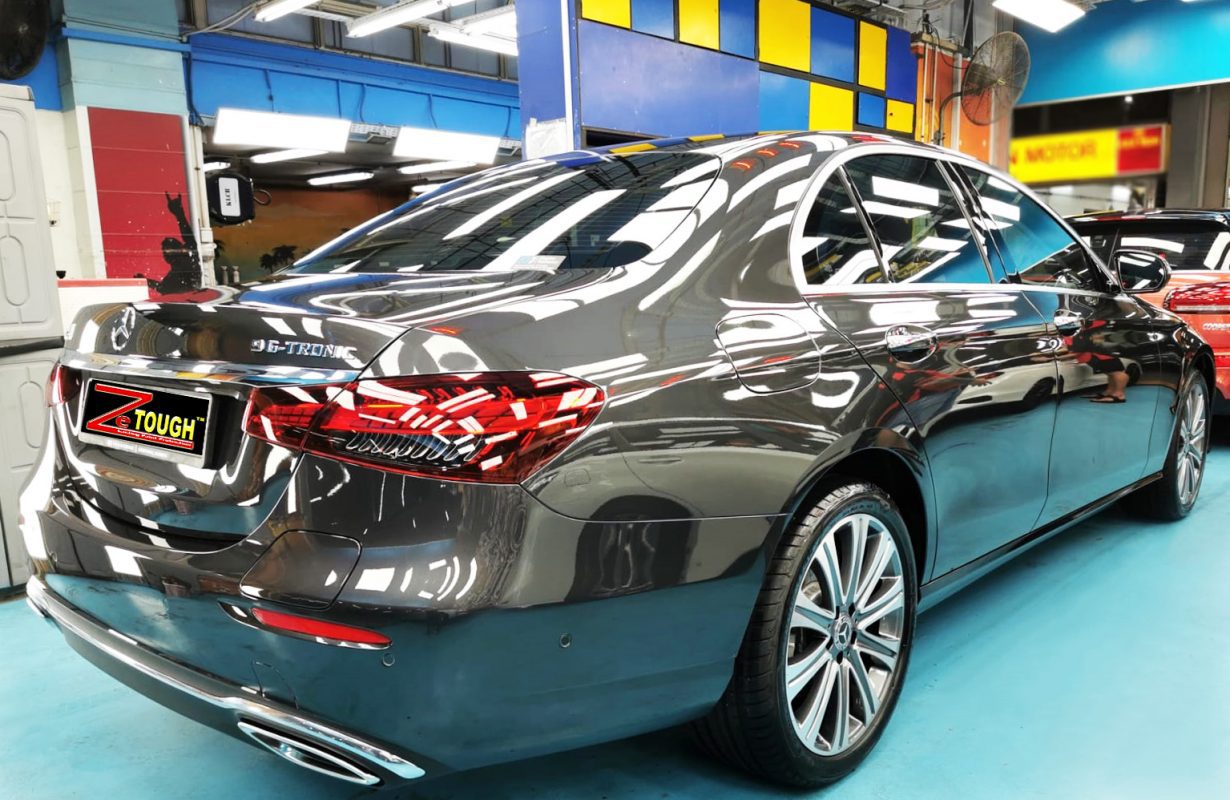 Rear quarter of the E300e, glossy and protected.