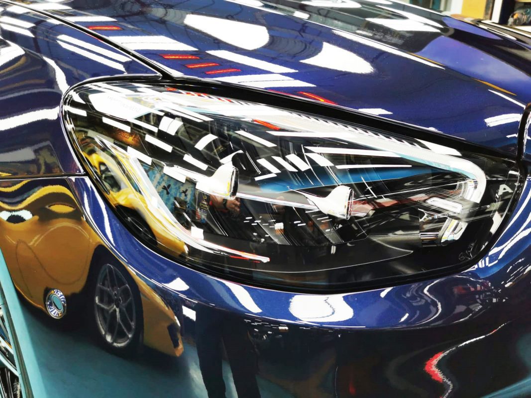 The E300e's coated paintwork holding clean reflections.