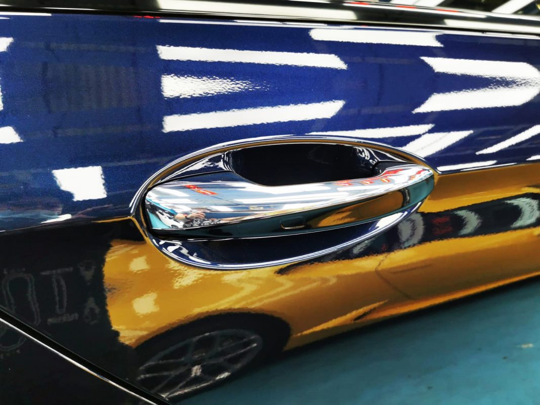 Rear quarter of the Mercedes-Benz E300e, glossy and protected.