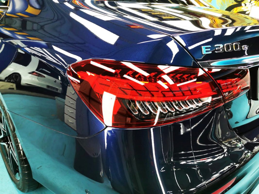 The bonnet of the E300e under workshop lighting.