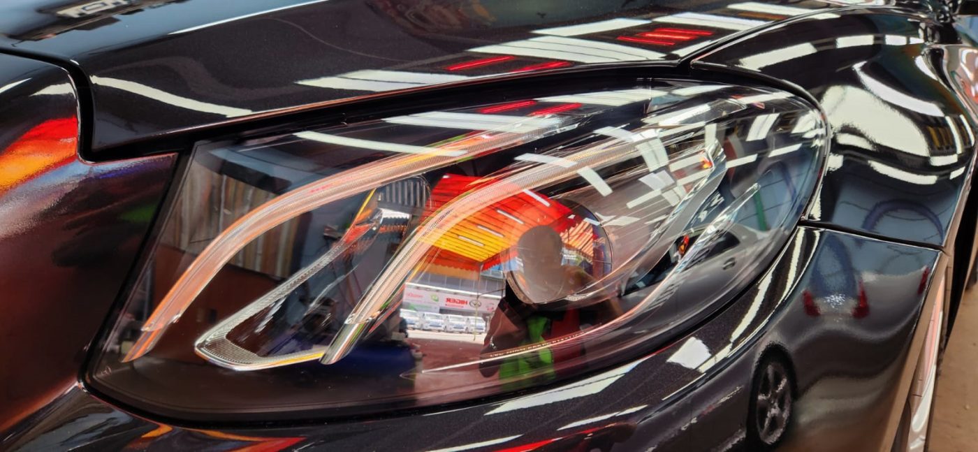 The E350's coated paintwork holding clean reflections.