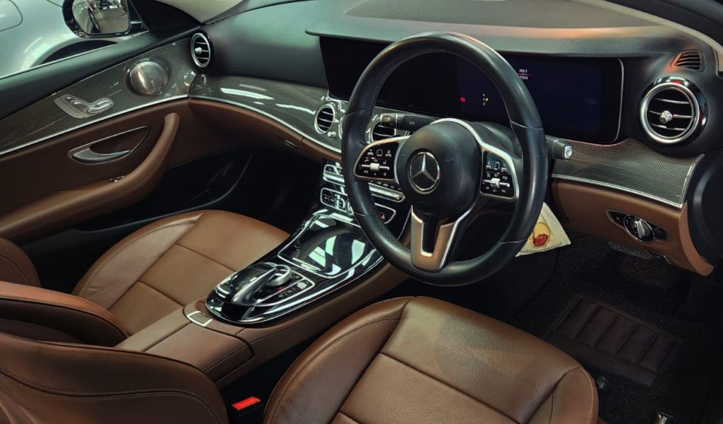 The Mercedes-Benz E350 parked in the workshop, freshly coated.
