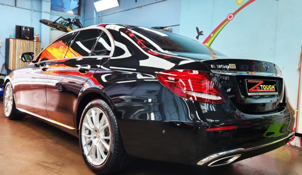 Rear quarter of the Mercedes-Benz E350, glossy and protected.
