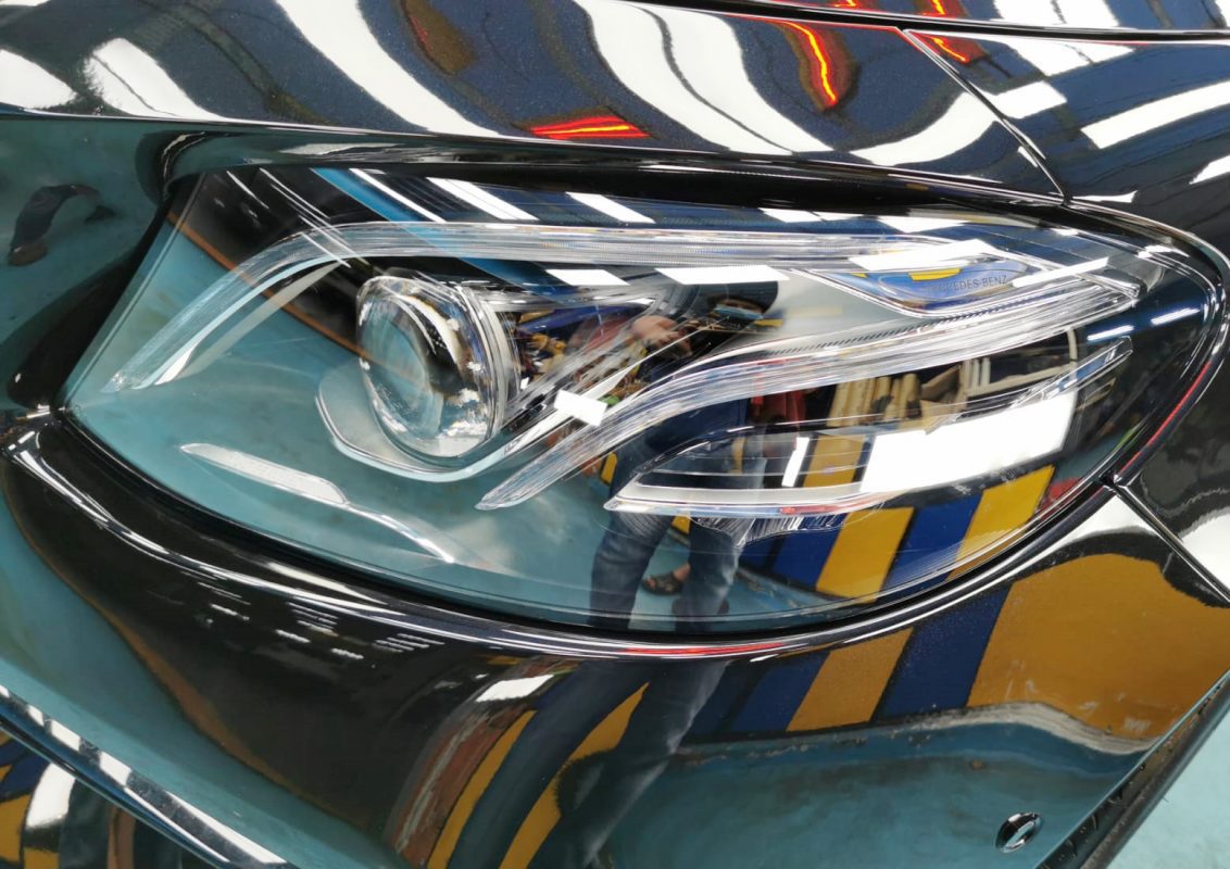 The E63's coated paintwork holding clean reflections.