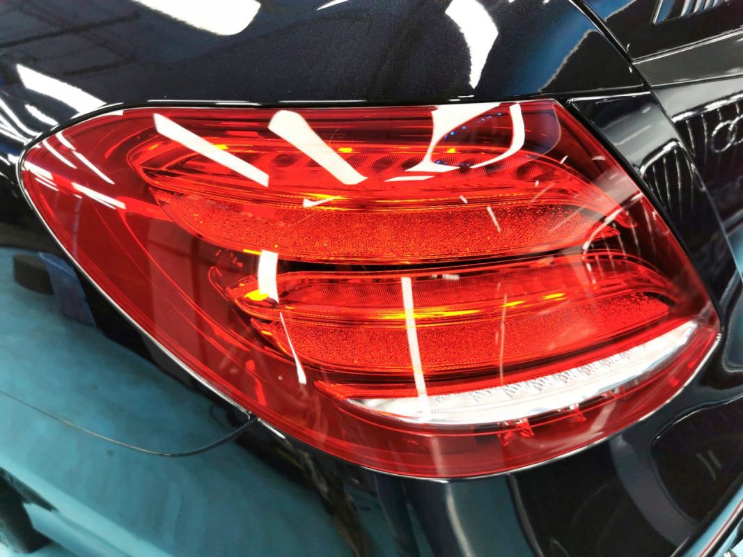 The bonnet of the E63 under workshop lighting.