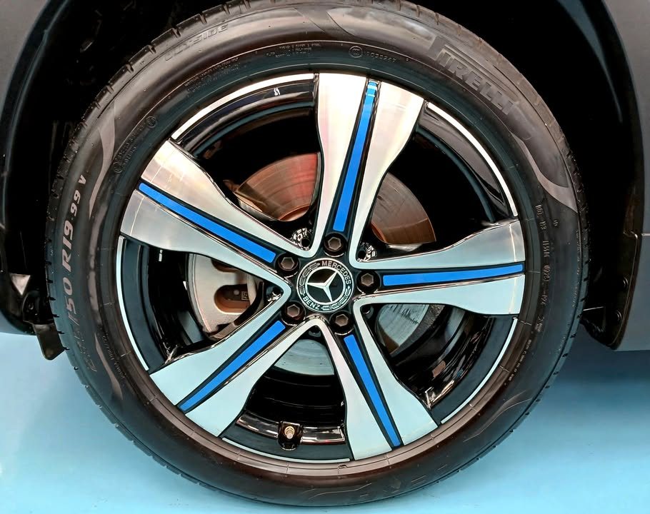 Alloy wheel with blue accents and a Mercedes-Benz centre cap.