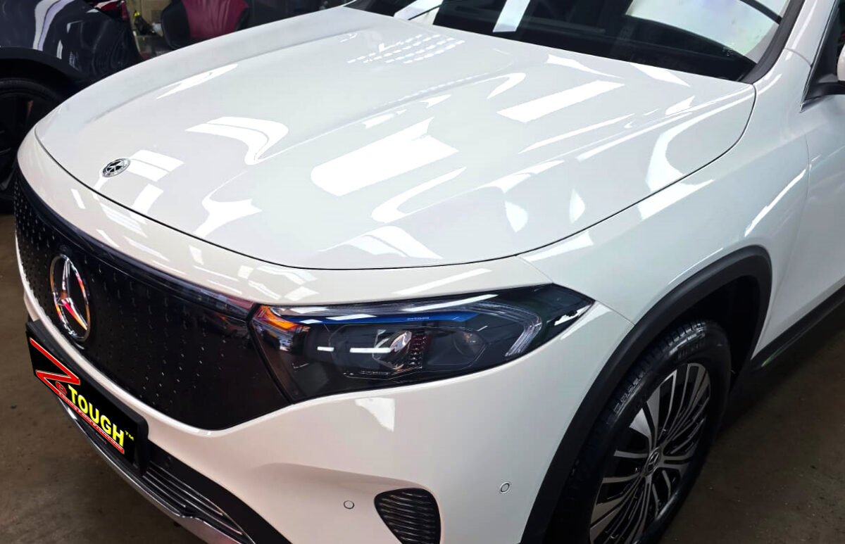 The Mercedes-Benz EQB 250+ from a side angle after the titanium coating.