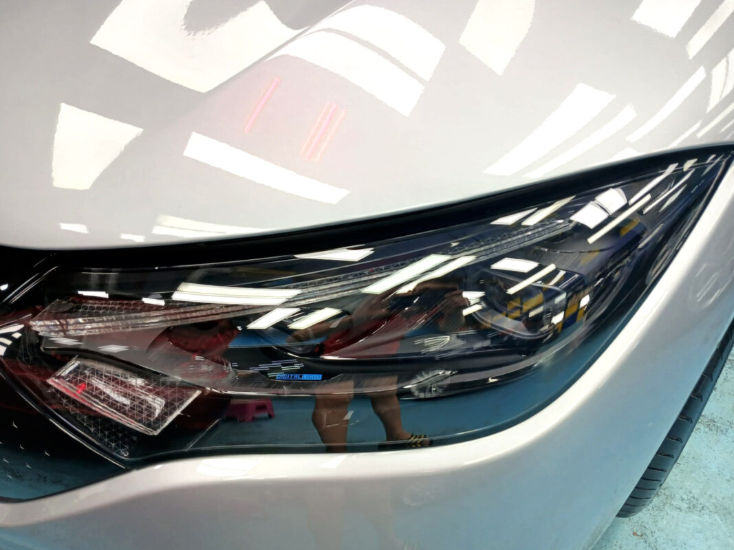 The Mercedes-Benz EQE 300 from a side angle after the titanium coating.