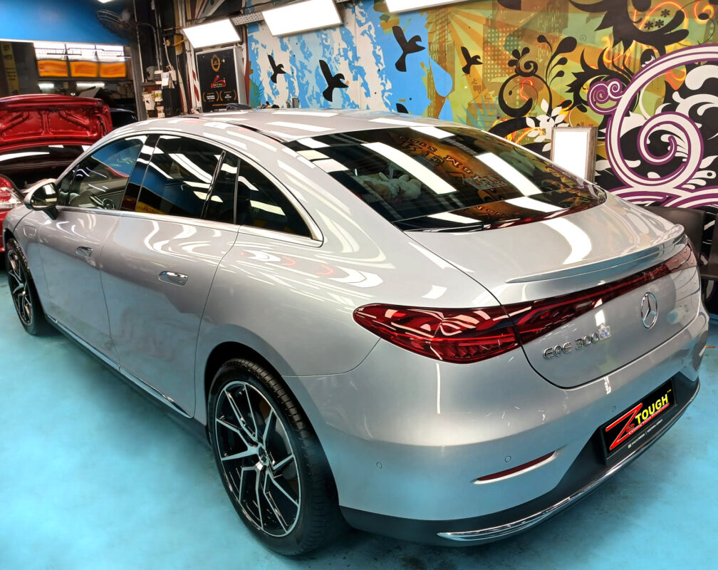 The Mercedes-Benz EQE 300 parked in the workshop, freshly coated.