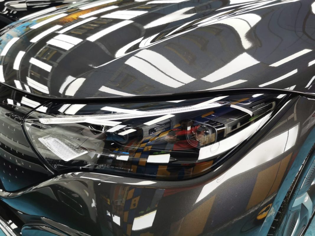 The EQE 350's coated paintwork holding clean reflections.