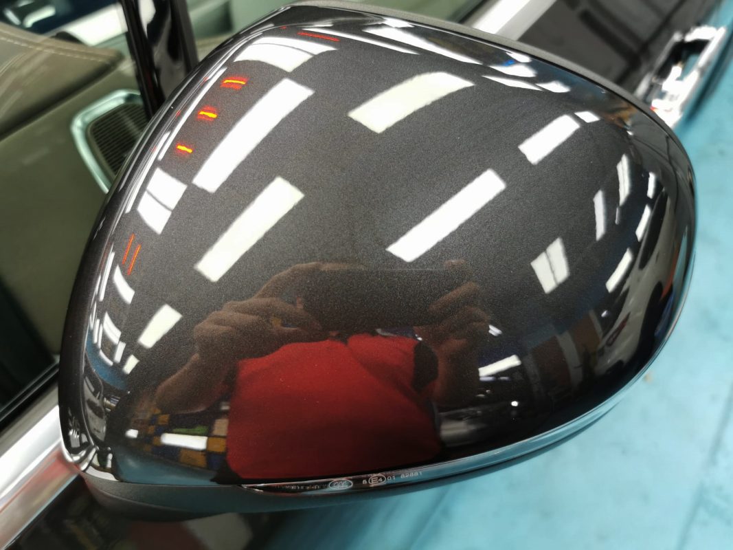 The Mercedes-Benz EQE 350 parked in the workshop, freshly coated.