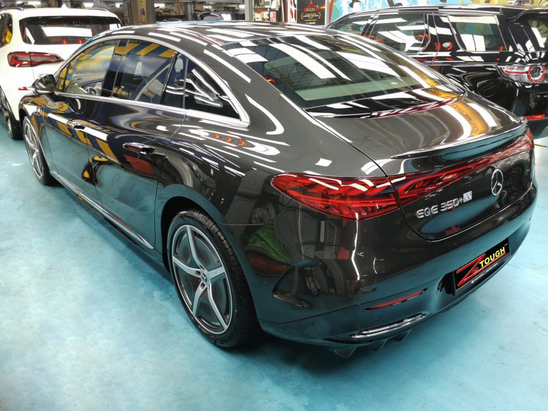 Rear quarter of the Mercedes-Benz EQE 350, glossy and protected.