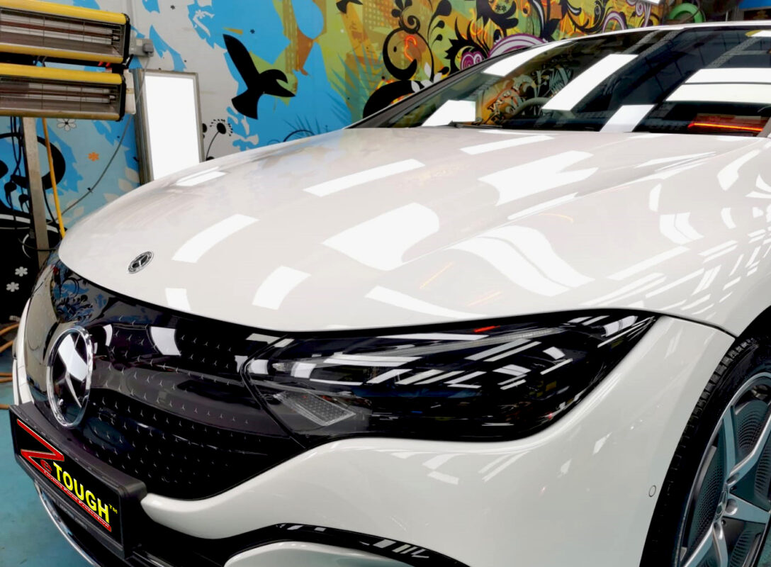 The Mercedes-Benz EQE350 from a side angle after the titanium coating.