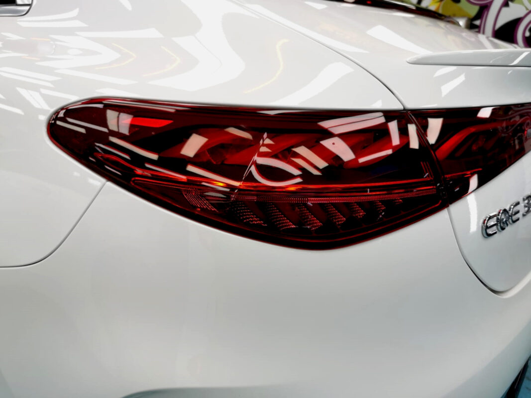Rear quarter of the Mercedes-Benz EQE350, glossy and protected.