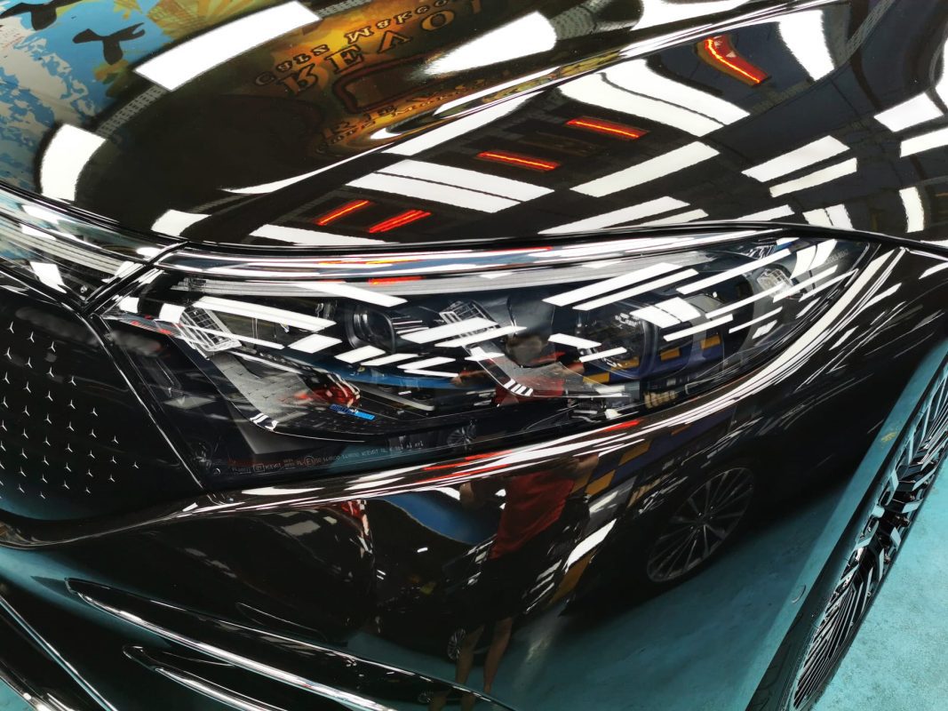 The EQS 450+'s coated paintwork holding clean reflections.