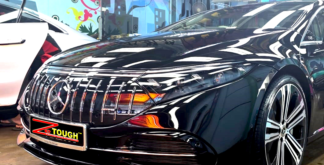The Mercedes-Benz EQS450 from a side angle after the titanium coating.