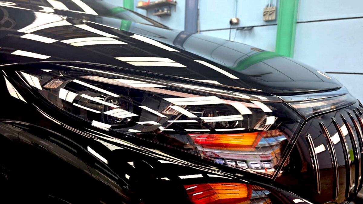The EQS450's coated paintwork showing clean reflections.