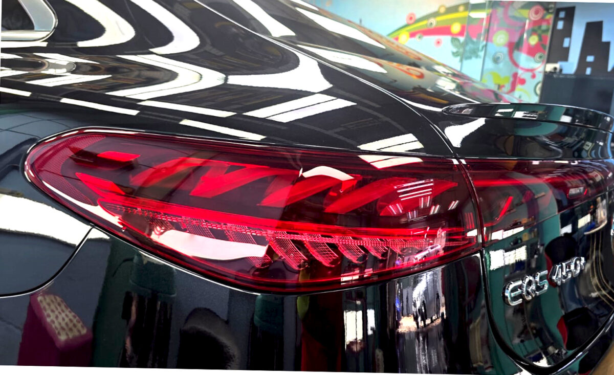 Rear quarter of the Mercedes-Benz EQS450, glossy and protected.