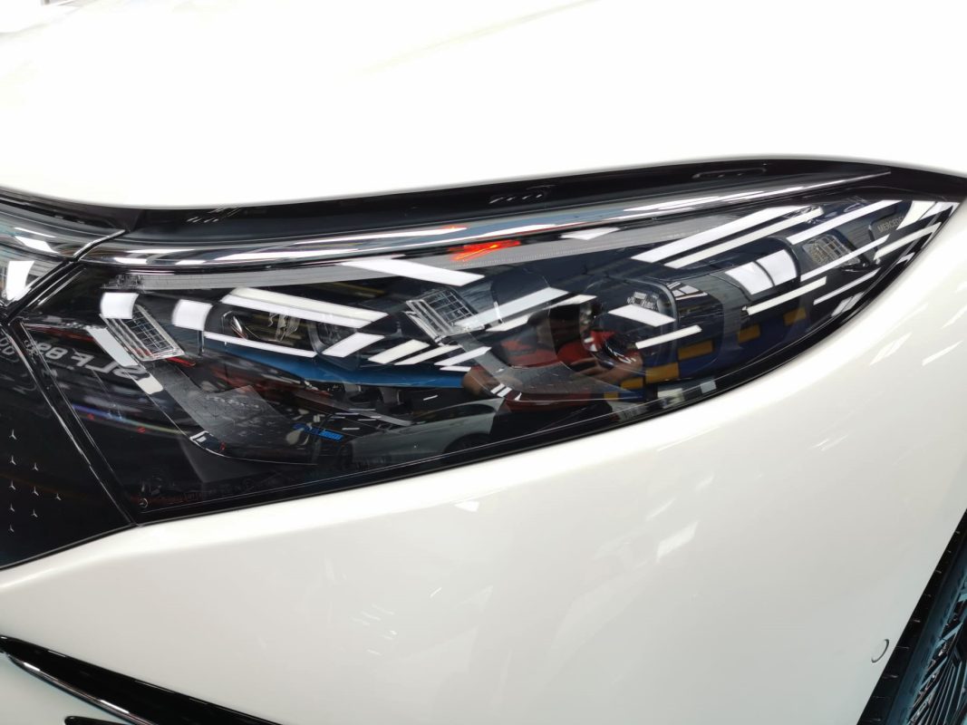 The EQS450+'s coated paintwork holding clean reflections.