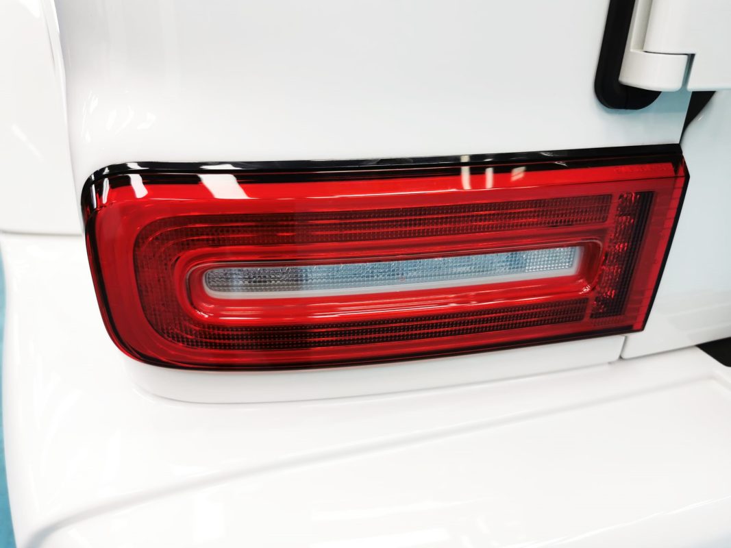 The bonnet of the G400 AMG under workshop lighting.