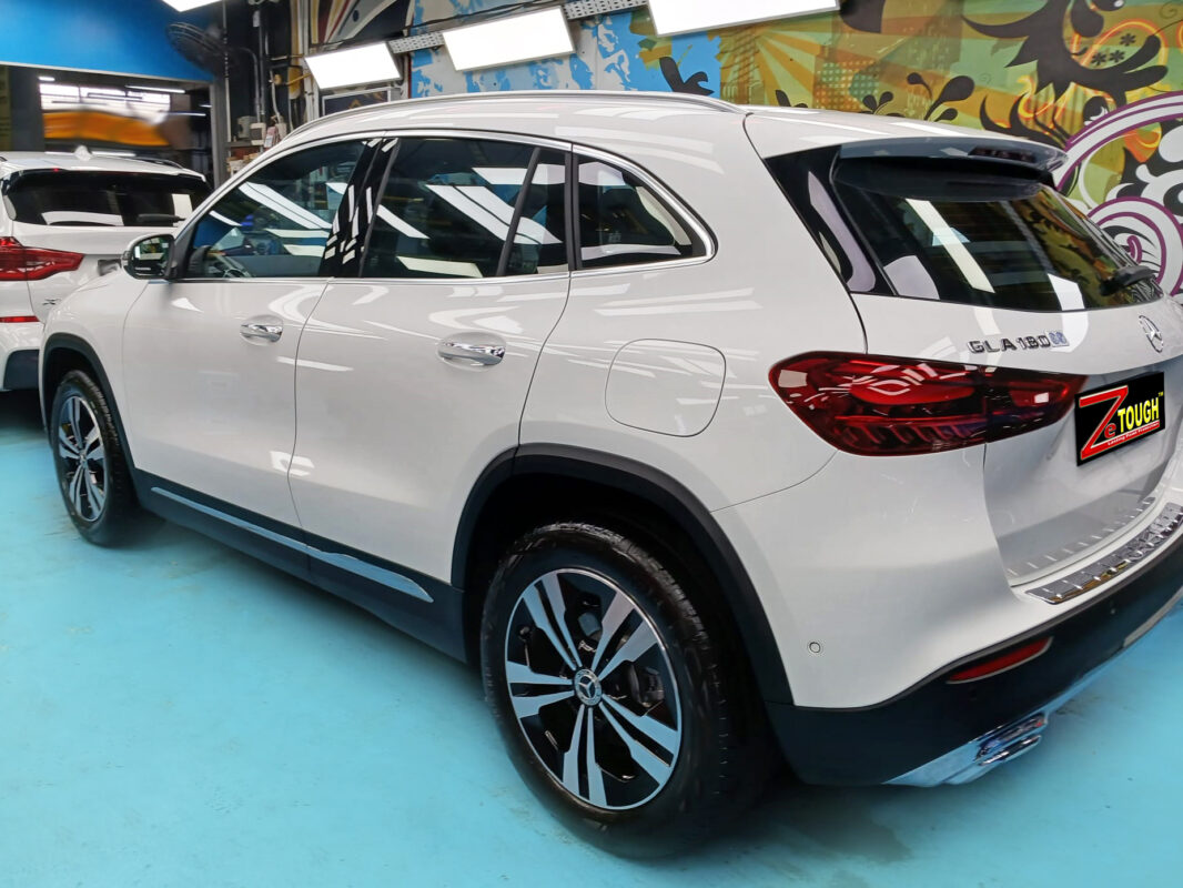 Rear quarter of the Mercedes-Benz GLA180, glossy and protected.
