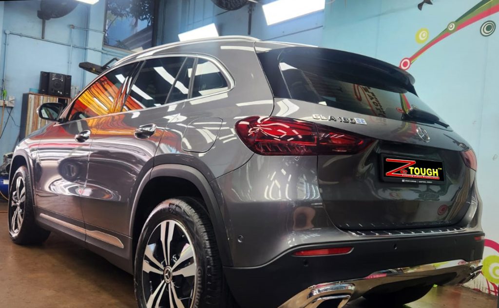 Rear quarter of the Mercedes-Benz GLA180, glossy and protected.