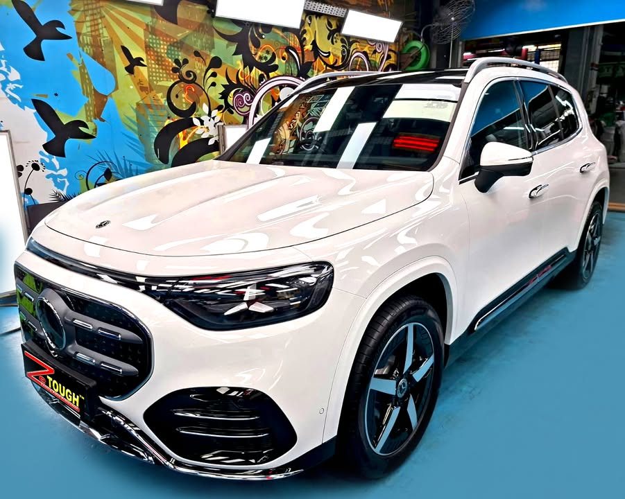 White Mercedes-Benz GLB 200 front three-quarter view in the Revol Carz workshop after ZeTough Ceramic coating.