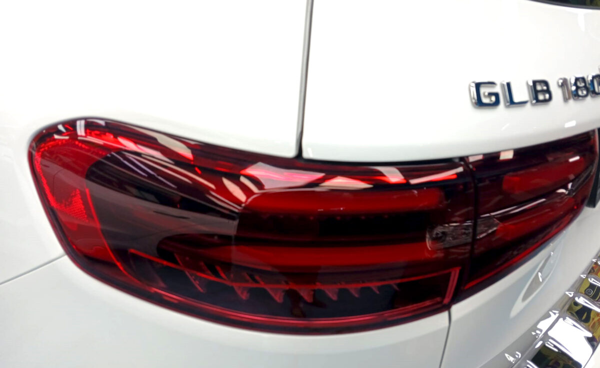Rear quarter of the Mercedes-Benz GLB180, glossy and protected.