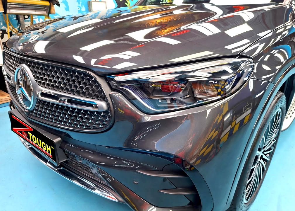 Front of the GLC showing the star-pattern grille and headlight, with a ZeTough plate on the bumper.