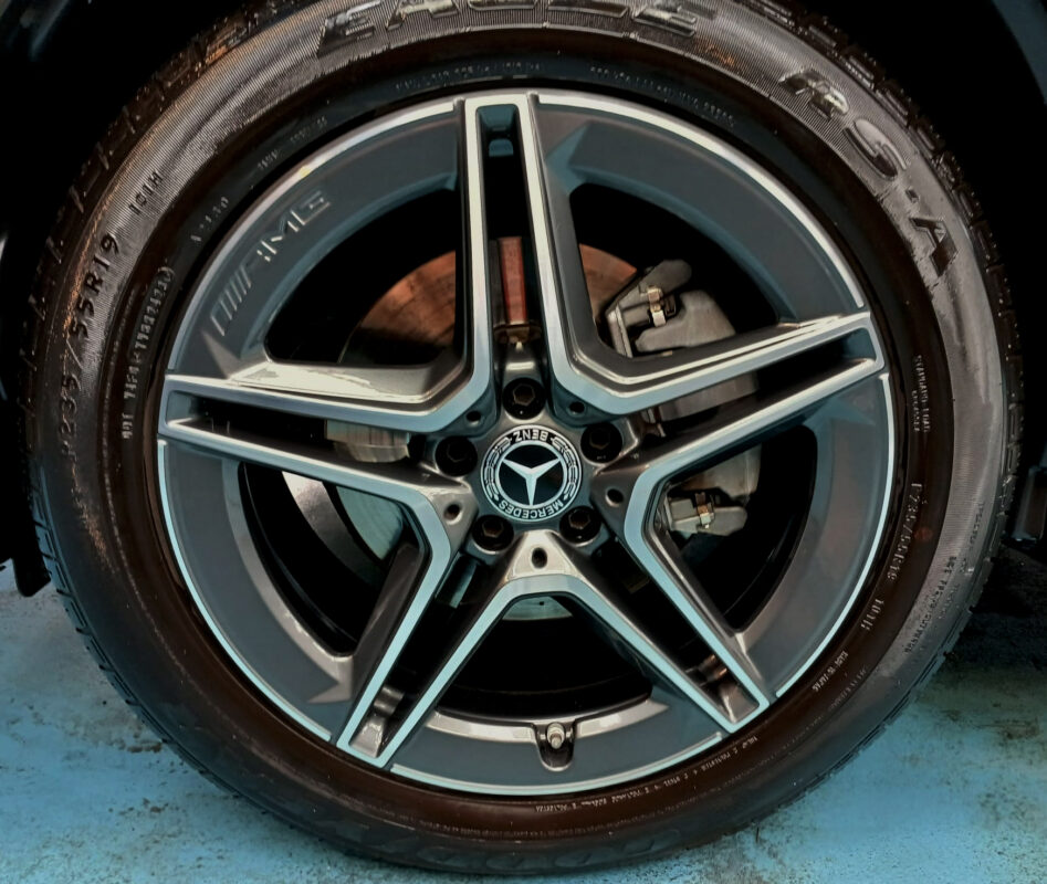 The coated bonnet of the Mercedes-Benz GLC200 under workshop lighting.