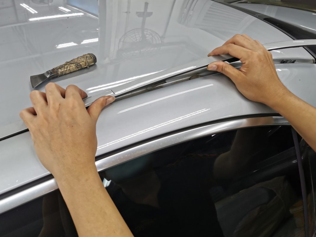 Car parts being dismantled from the S350L before spraying.