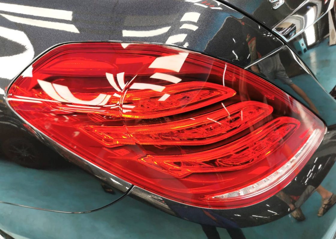 The coated bonnet of the S400L under workshop lighting.