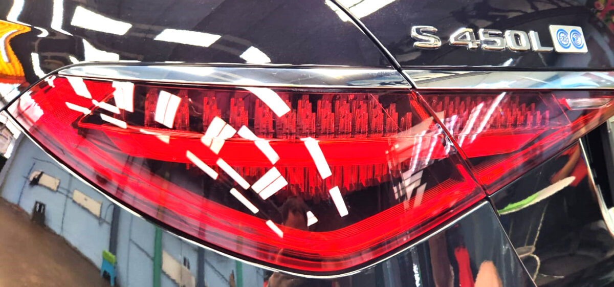 Rear quarter of the Mercedes-Benz S450L, glossy and protected.