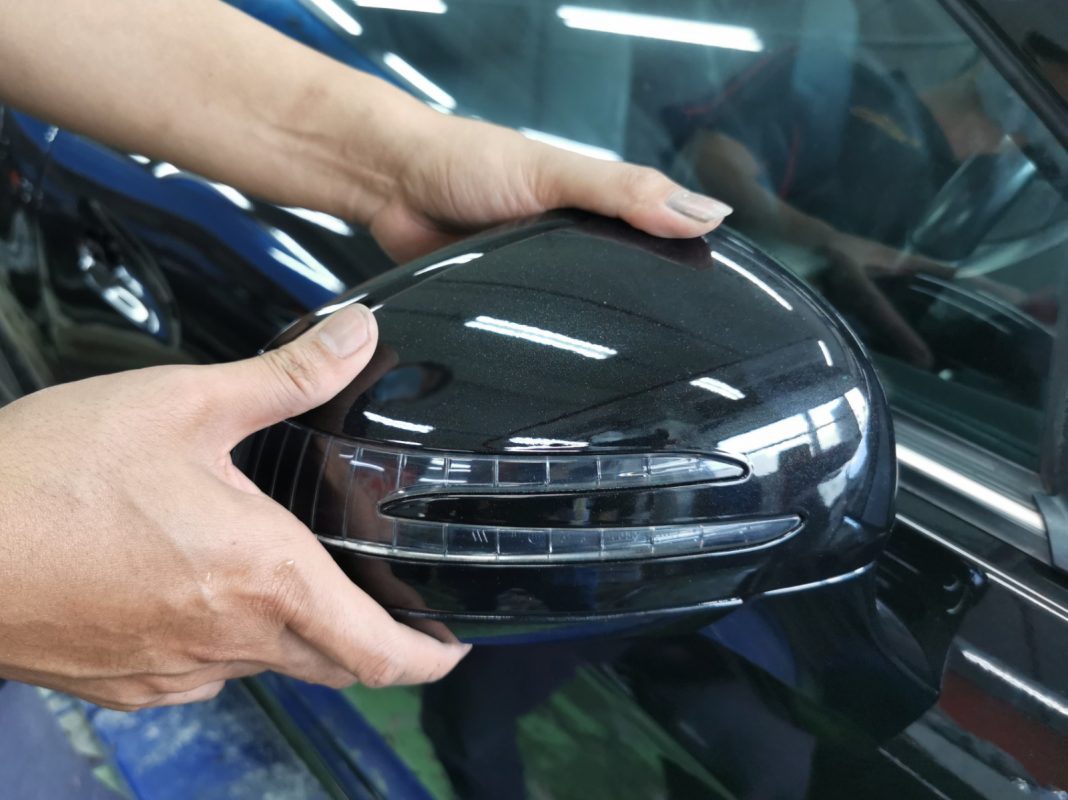 Buffing the new paint on the SLK200 to bring up the shine.