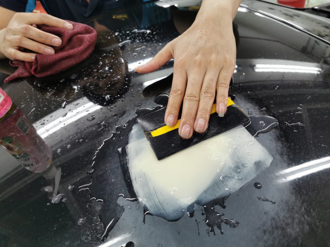 Continuing to wet-sand the body in preparation for spraying.