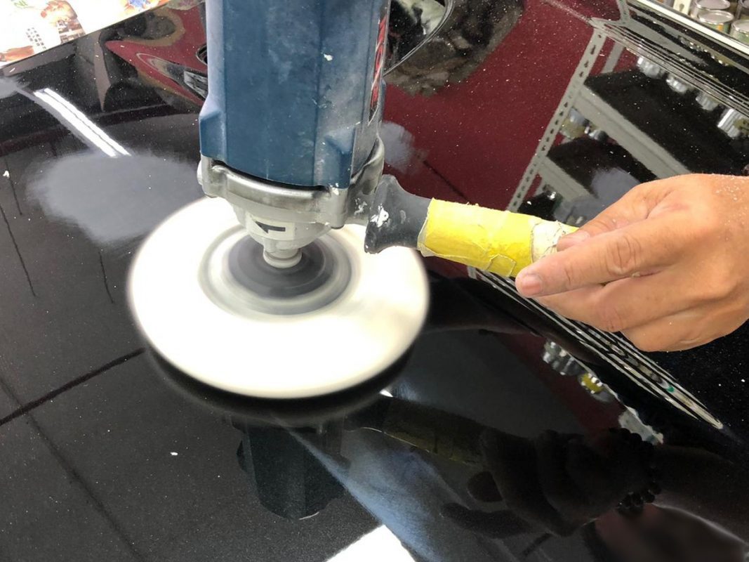 Buffing the new paint on the SLK200 to bring up the shine.