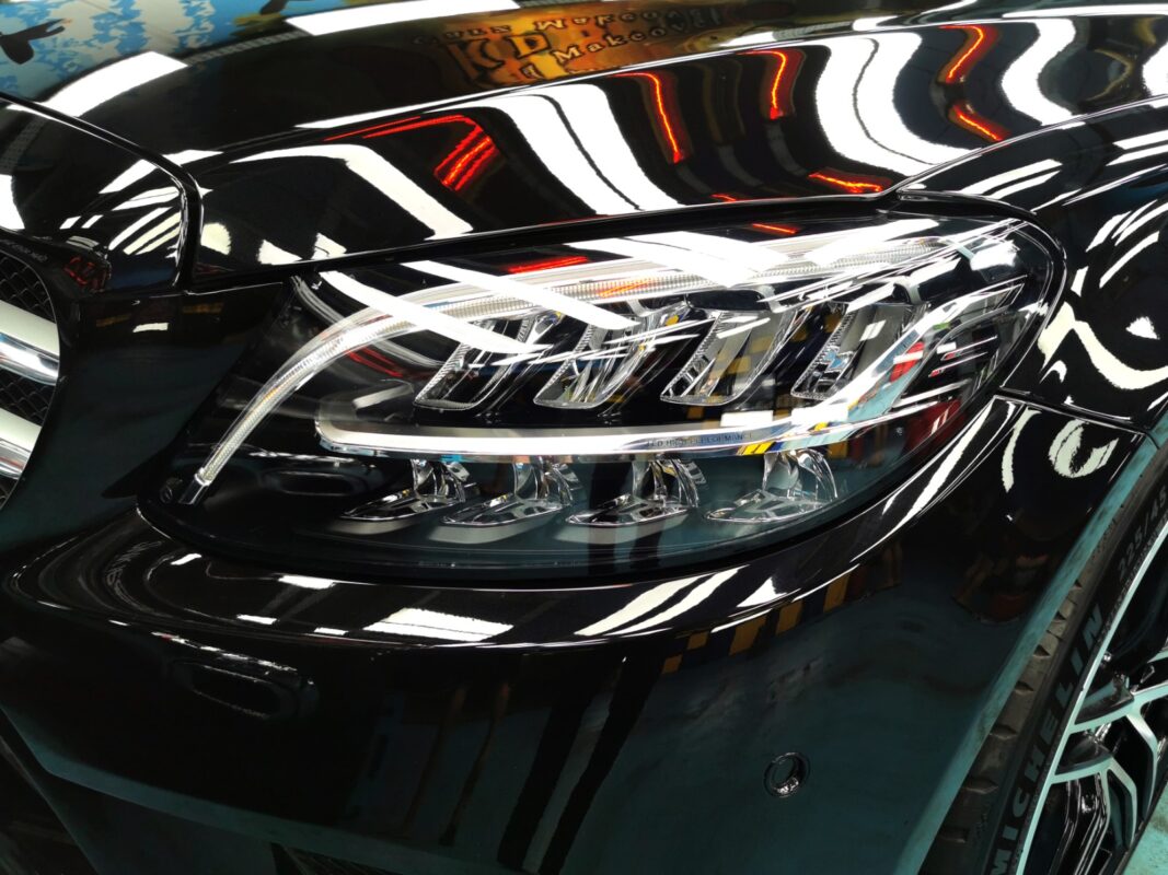 The C200's headlight and front panel detail after the respray.