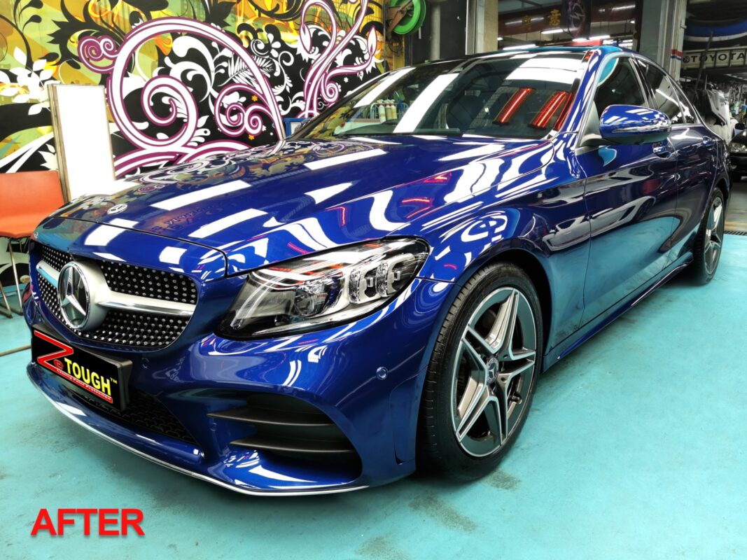 The finished Mercedes-Benz C200 in deep blue, front three-quarter view.