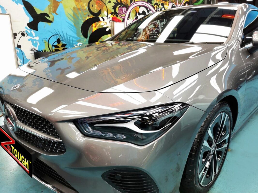 The Mercedes-Benz CLA180's coated paintwork under workshop lighting.