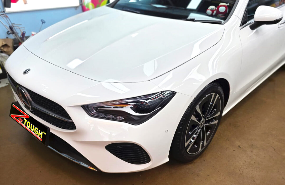 The Mercedes-Benz CLA180's coated paintwork under workshop lighting.