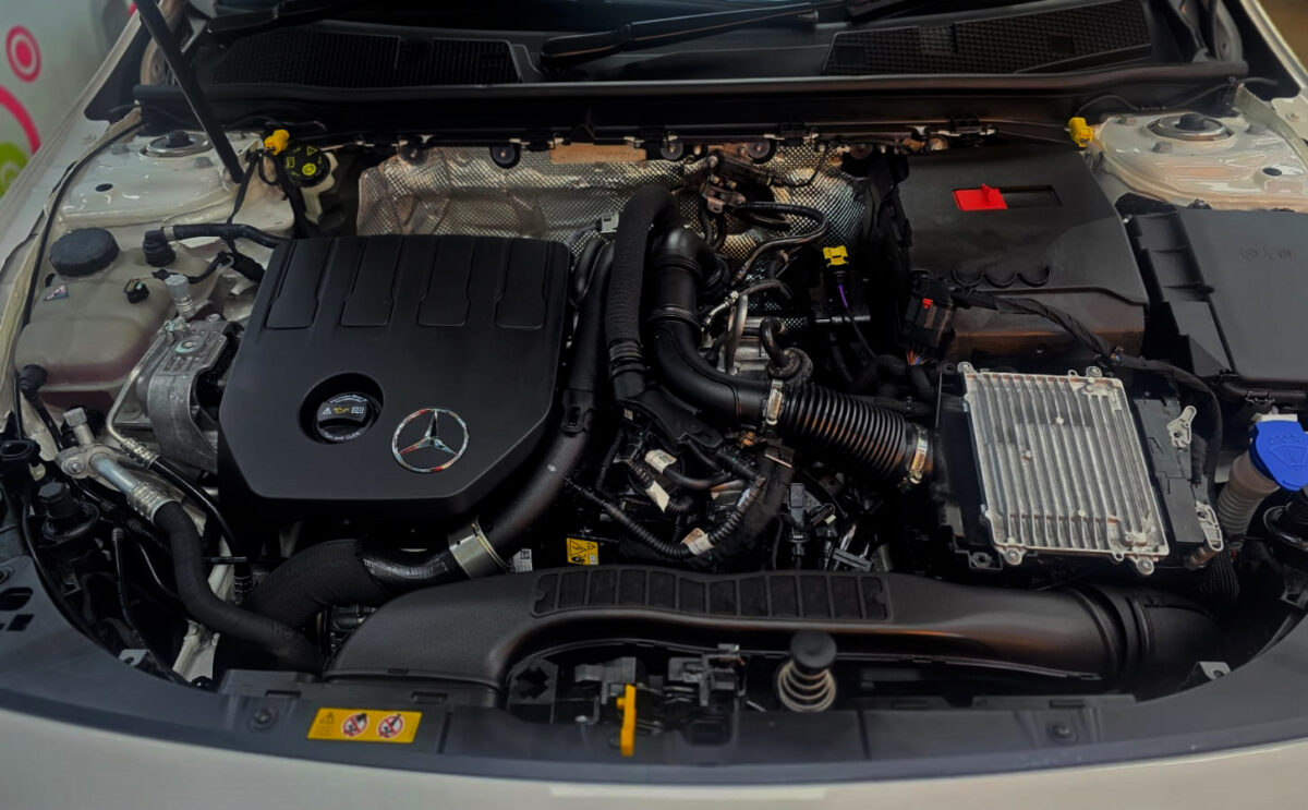Reflections across the coated panels of the Mercedes-Benz CLA180.