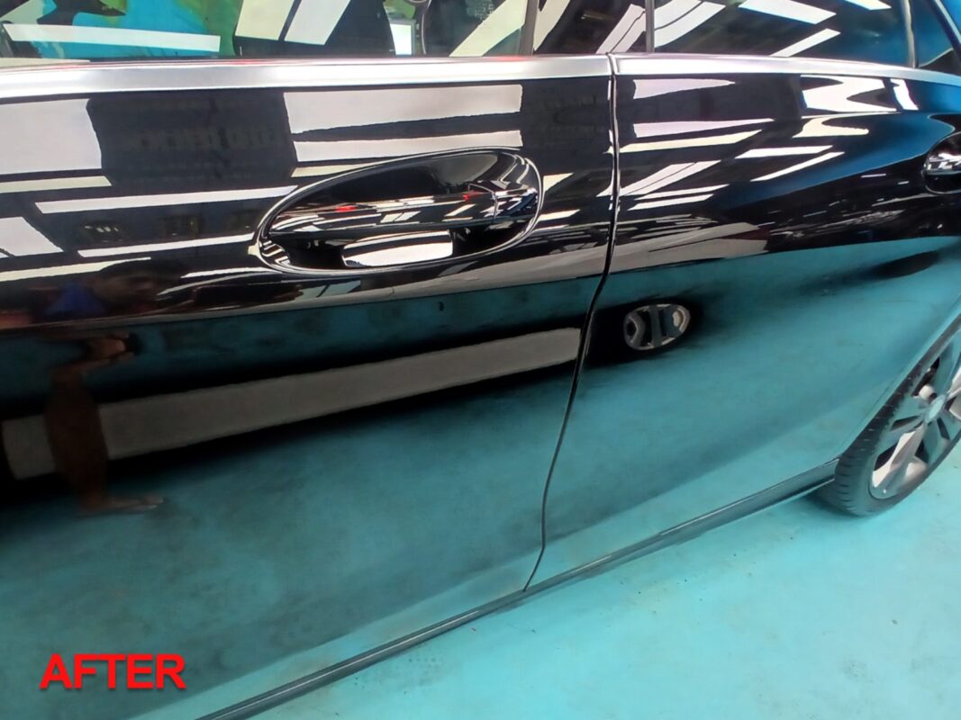 After: the same door panel, resprayed to a clean, even finish.