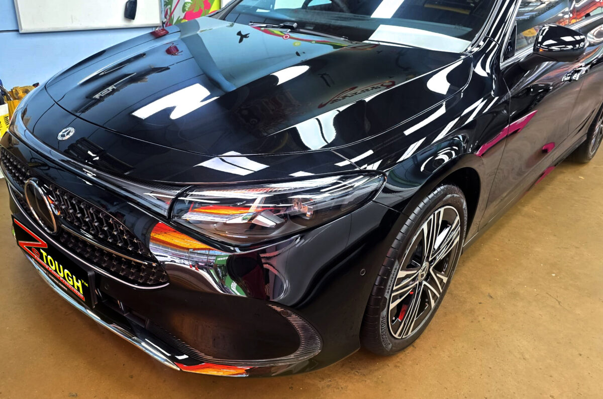 The Mercedes-Benz CLA180's coated paintwork under workshop lighting.