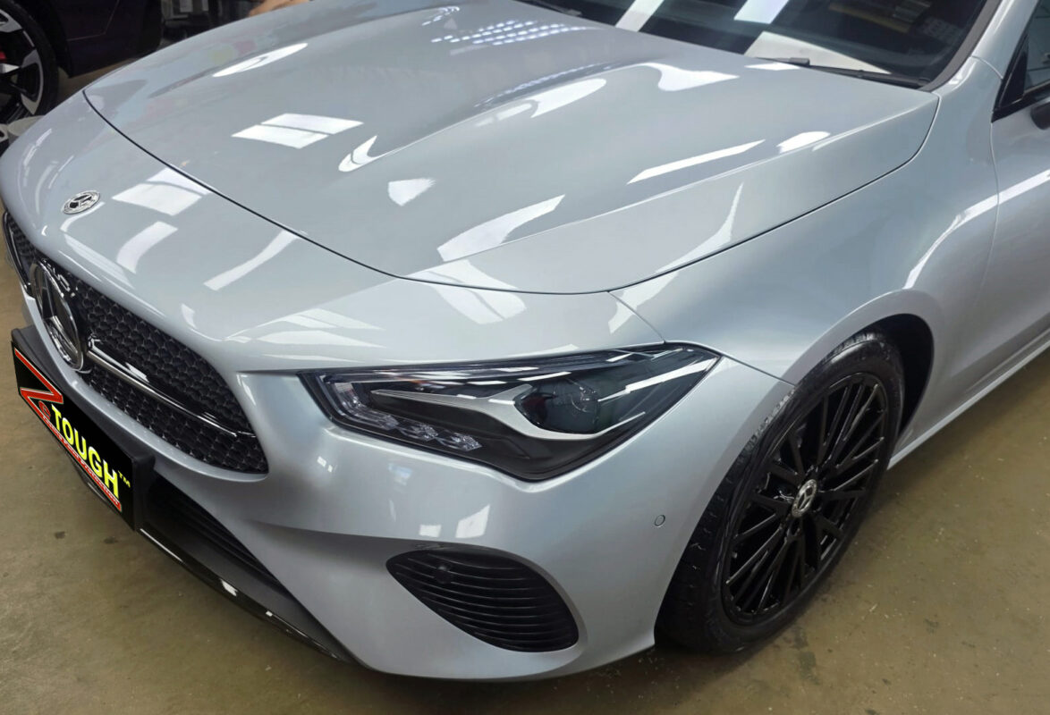 The Mercedes-Benz CLA180's coated paintwork under workshop lighting.