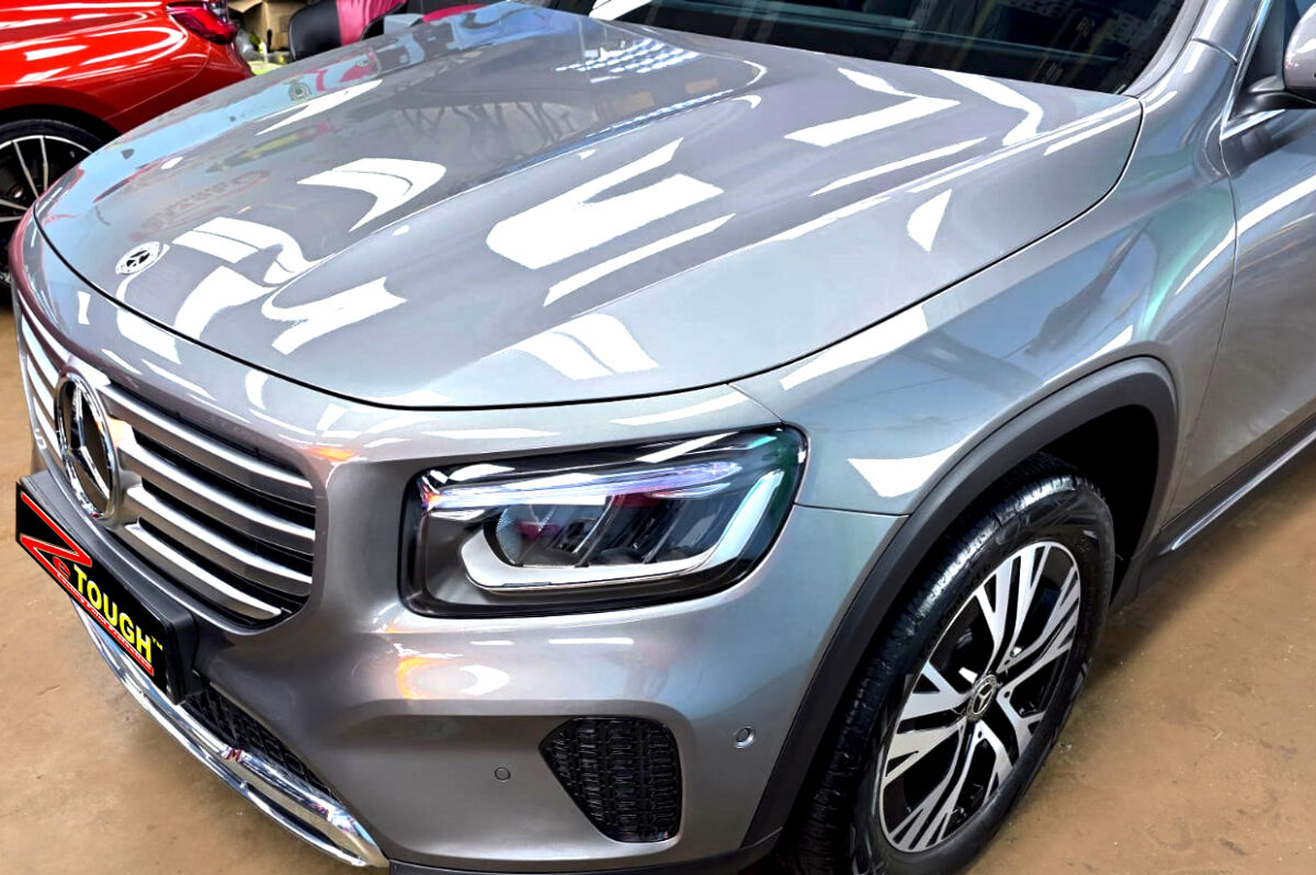 The Mercedes-Benz GLB180's coated paintwork under workshop lighting.