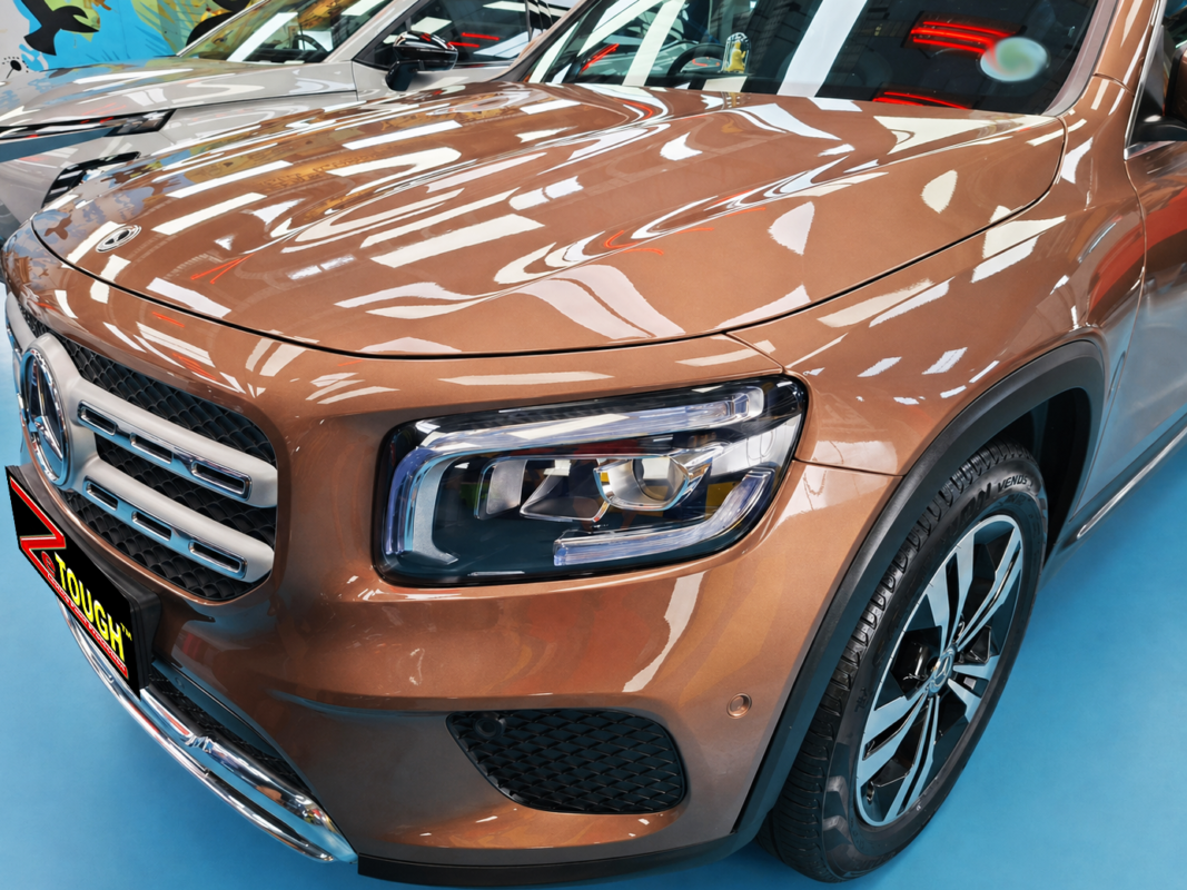 The Mercedes-Benz GLB180's coated paintwork under workshop lighting.