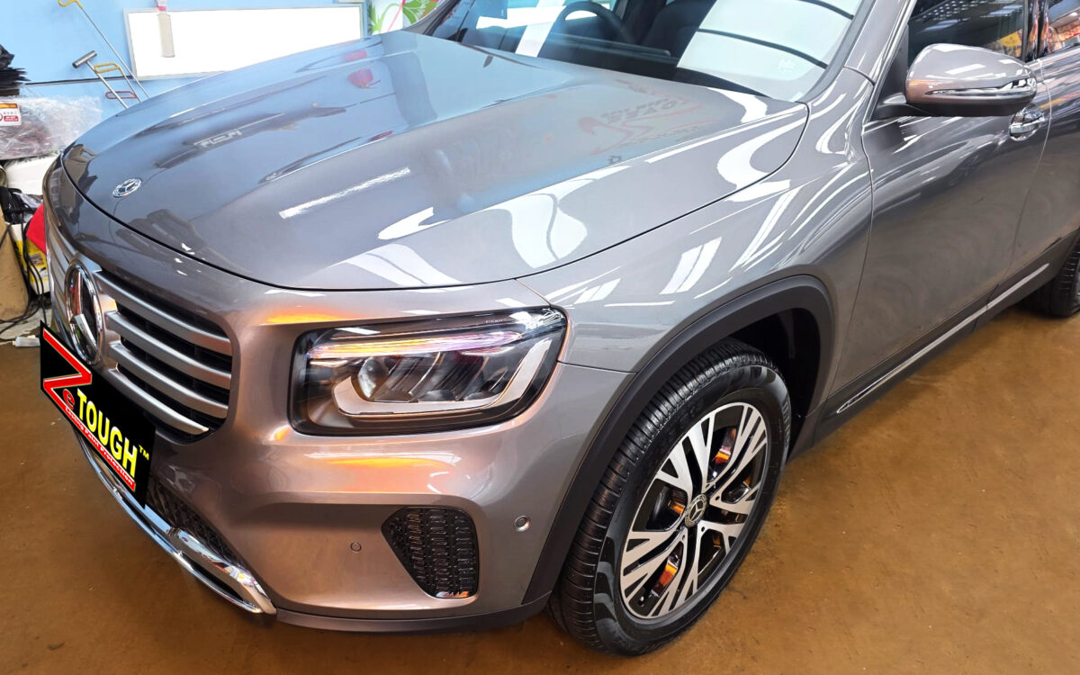The Mercedes-Benz GLB180's coated paintwork under workshop lighting.