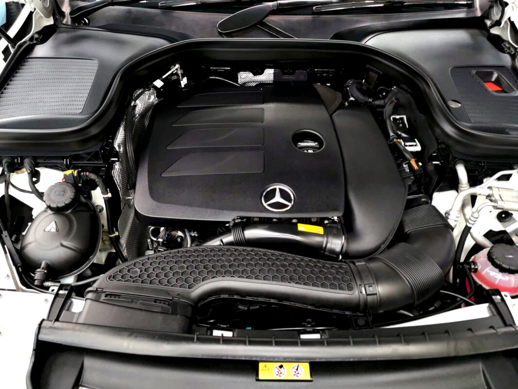 Reflections across the coated panels of the Mercedes-Benz GLC 300.