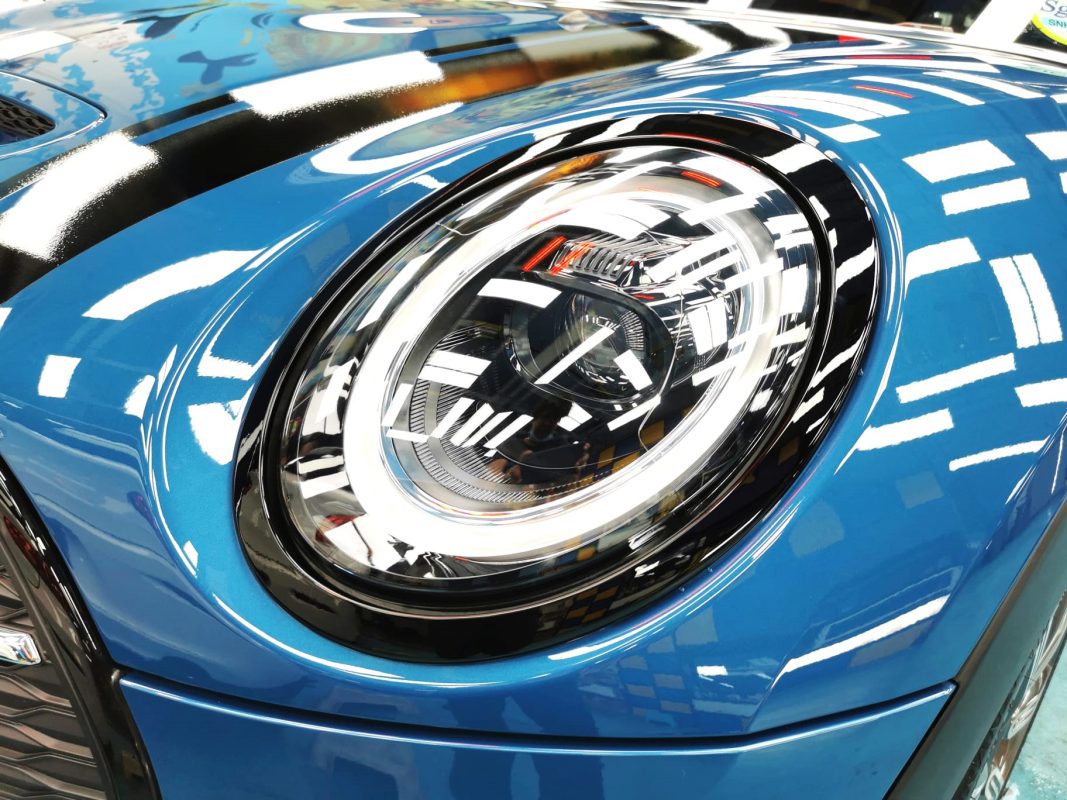 The Clubman Cooper's coated paintwork showing clean reflections.