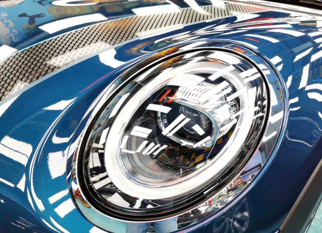 The MINI's coated paintwork showing clean reflections.